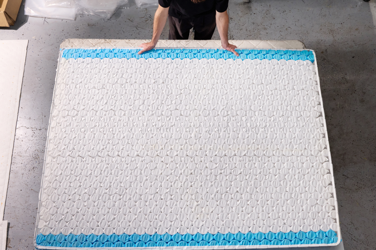 Top view of worker working on honeycomb pocketsprings in Ausbeds warehouse