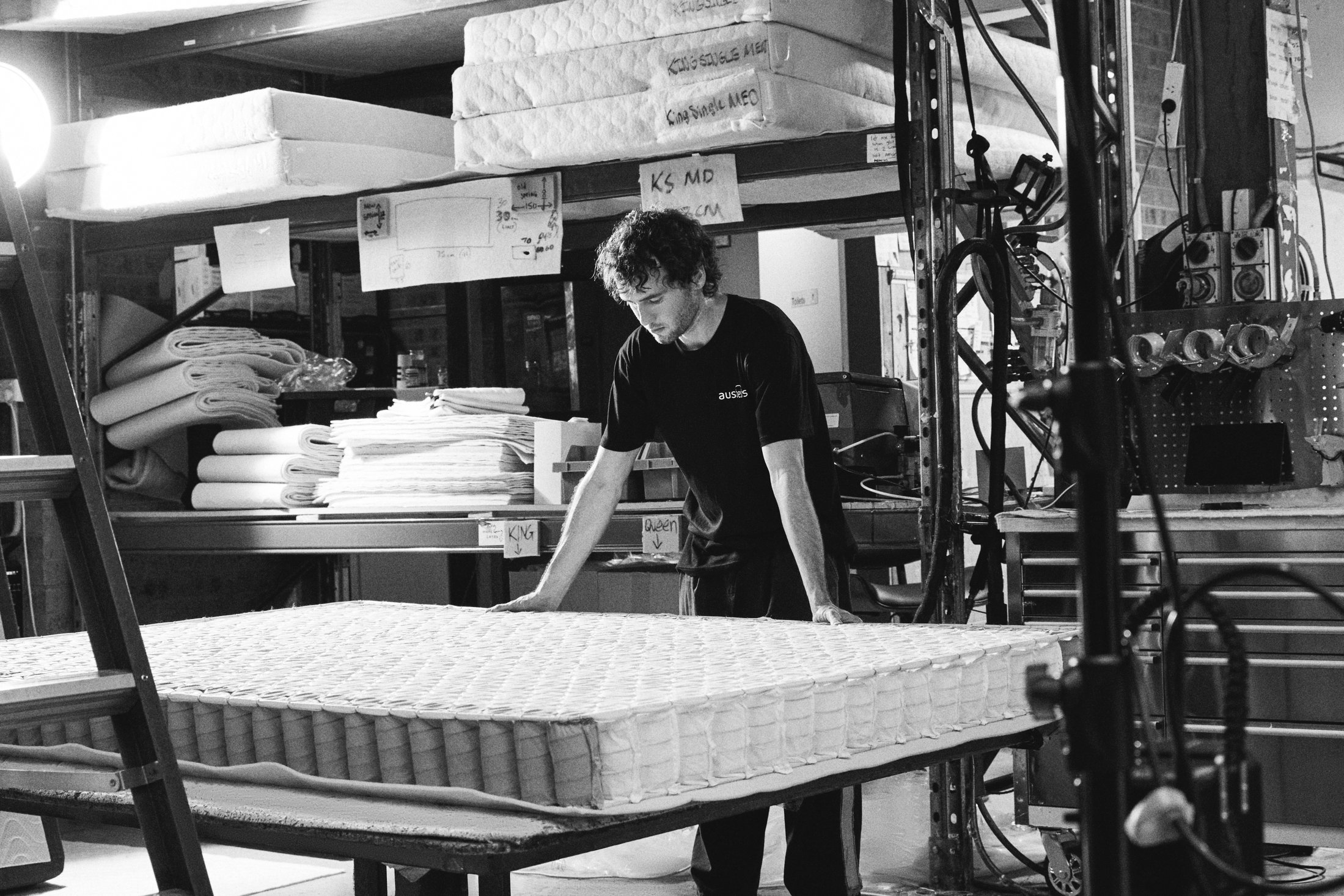 Factory Worker Inspecting Finished Mattress Bw