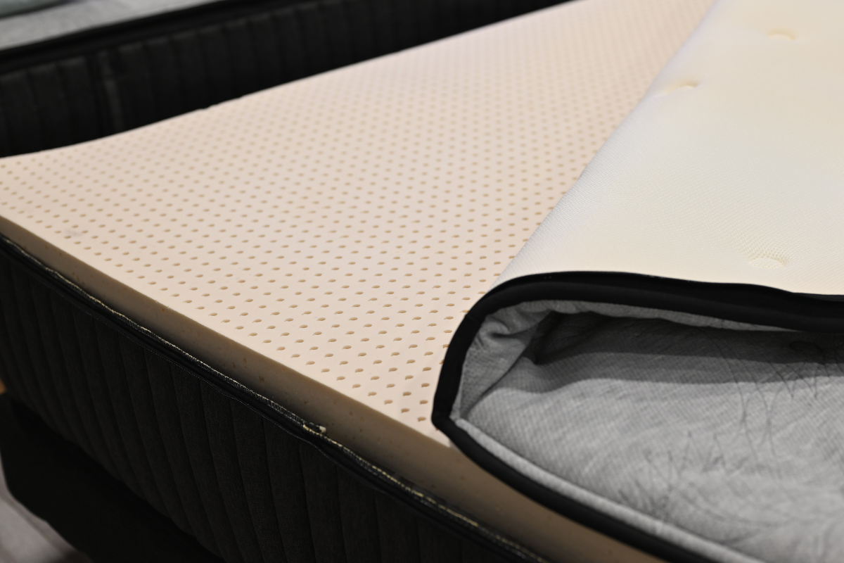 Close-up view of the Latex Comfort Layer in the Aurora Mattress, showing the natural latex texture and breathable pinhole design that provides responsive, pressure-relieving comfort.